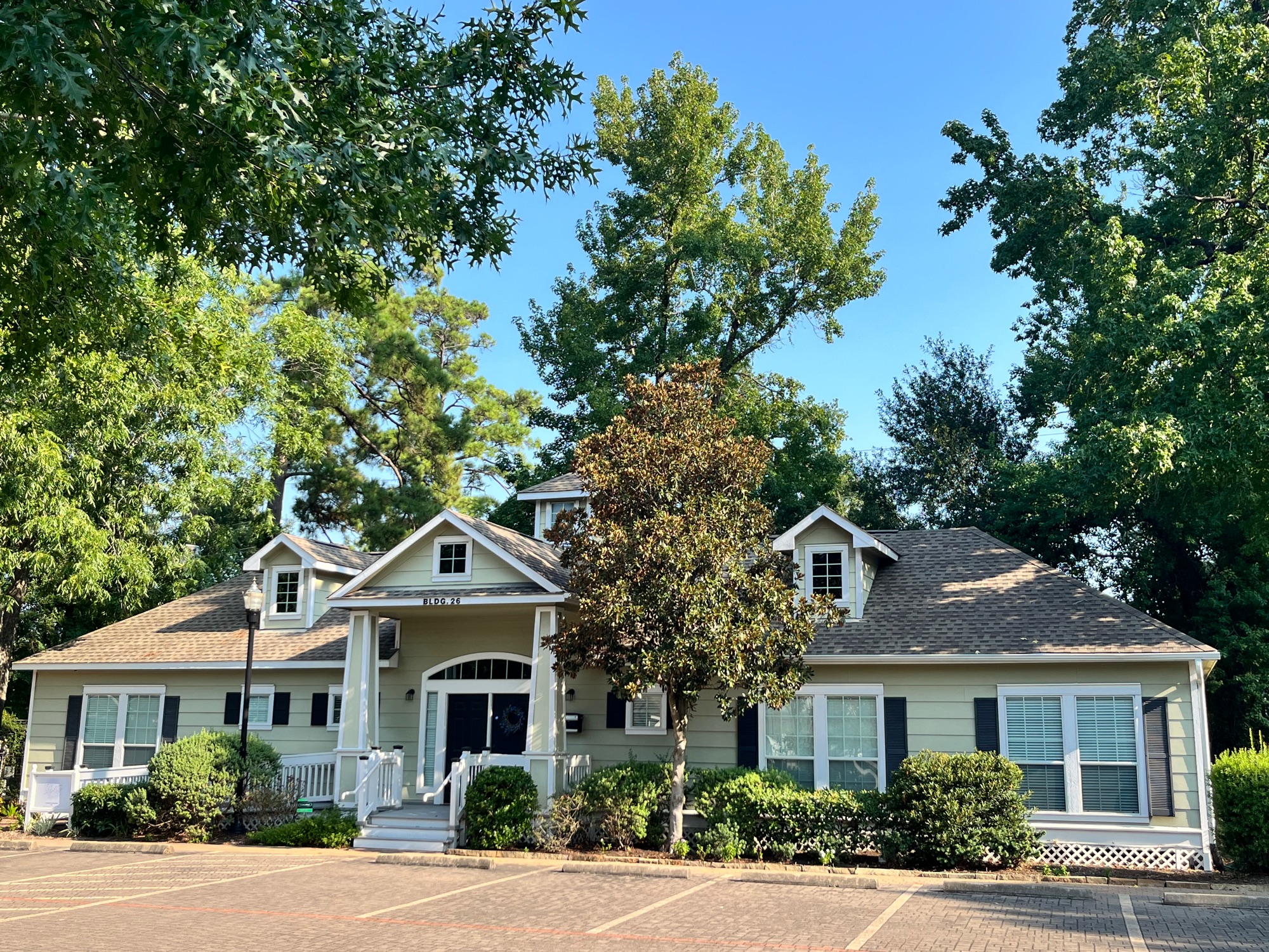 Stand-alone office building (Bldg. 26) with covered front porch at Pin Oak Park