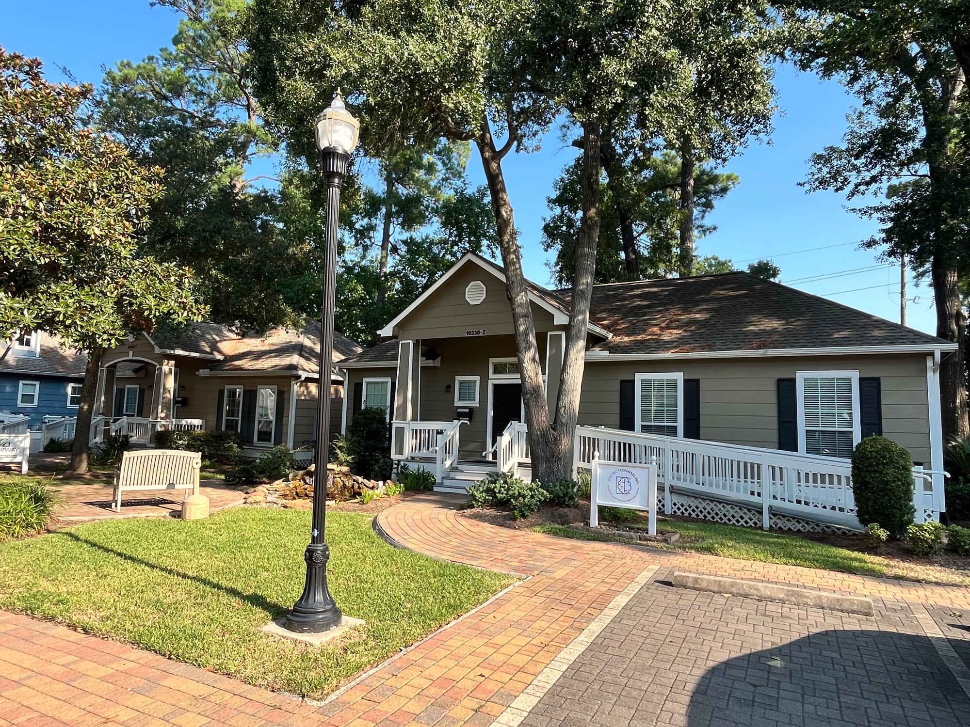Office building with pavestone walkway and accessible ramp at Pin Oak Park